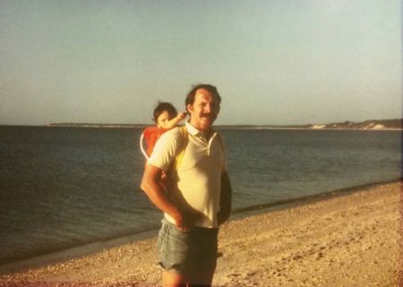 Kyra Zagorsky is posing for a picture with her dad.